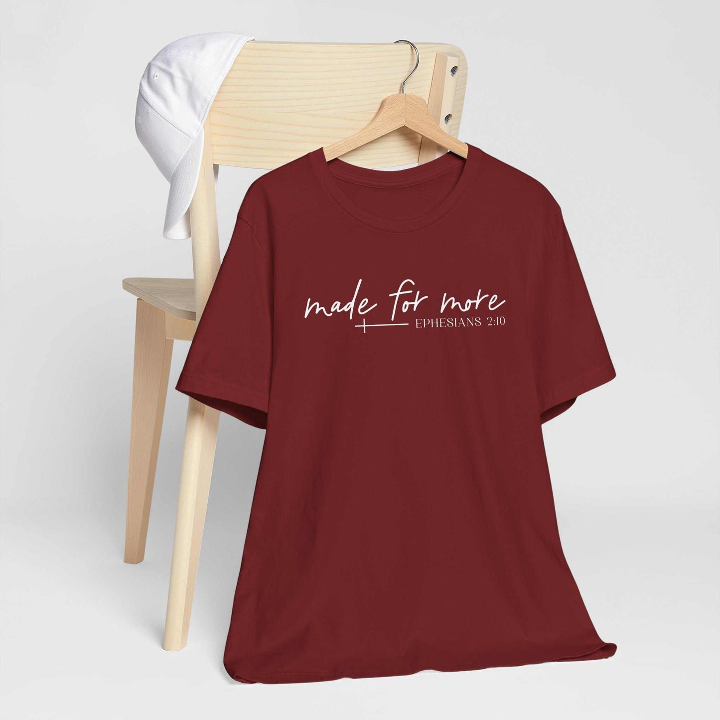 Woman wearing Made for More Faith Tee inspired by Ephesians 2:10 with simple script design