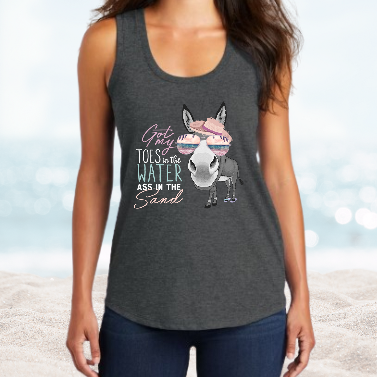 Women’s Vacation Toes in the Water graphic tank top with donkey and sunglasses design on beach background