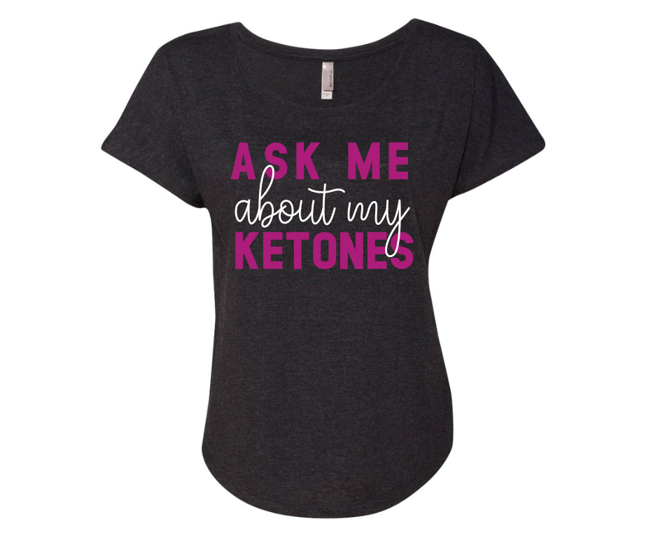 Black "Ask Me About My Ketones" shirt with vibrant pink and white text, made from a polyester, cotton, and rayon blend.