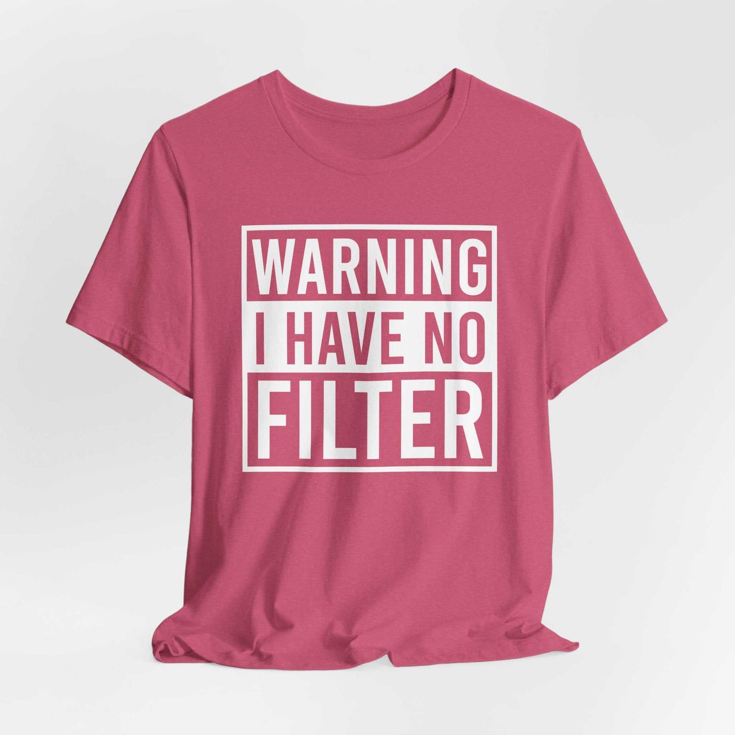 Woman wearing a black Bella Canvas 3001 unisex tee with "Warning I Have No Filter" printed on the front