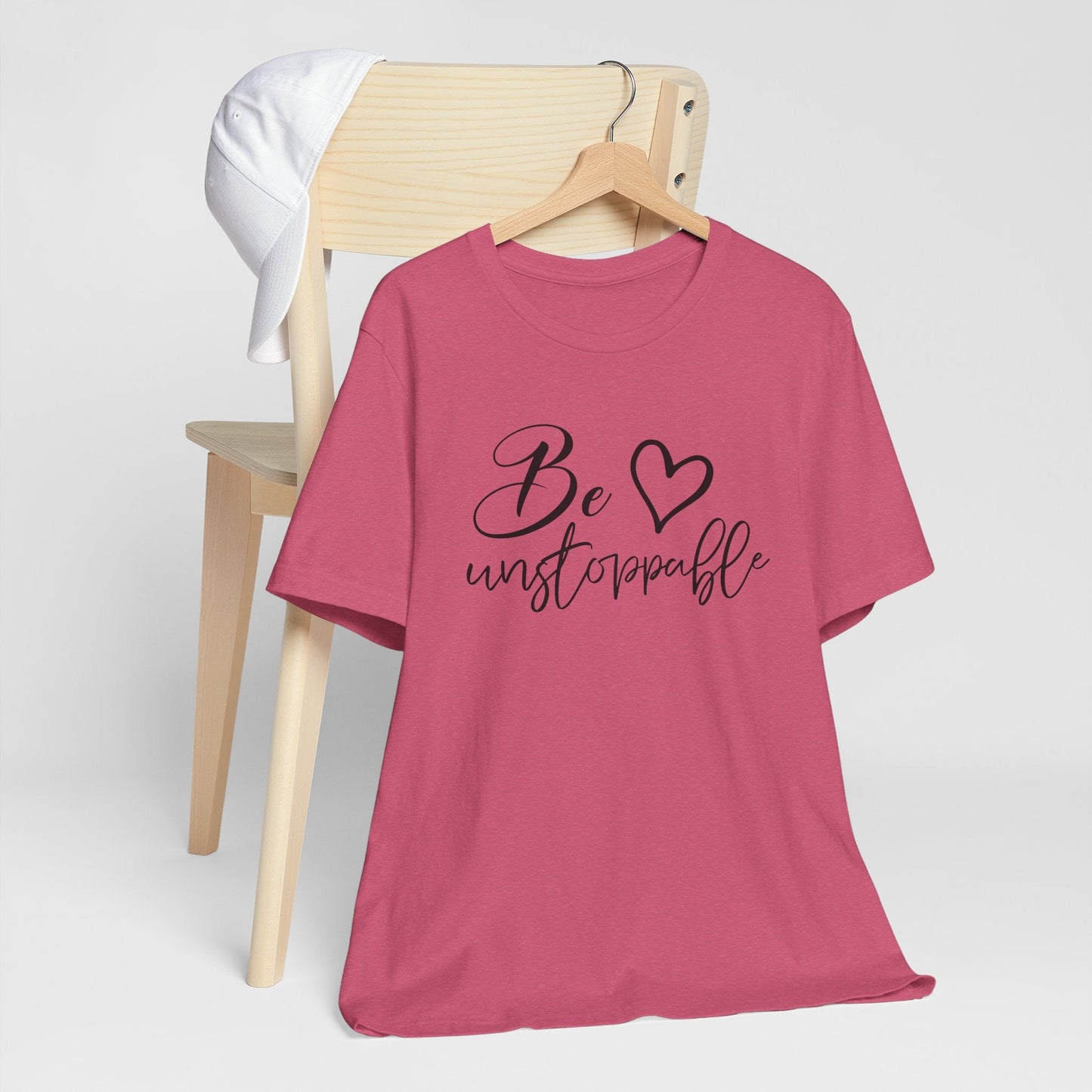 Woman confidently wearing soft breathable Unstoppable Energy Tee symbolizing strength and everyday power