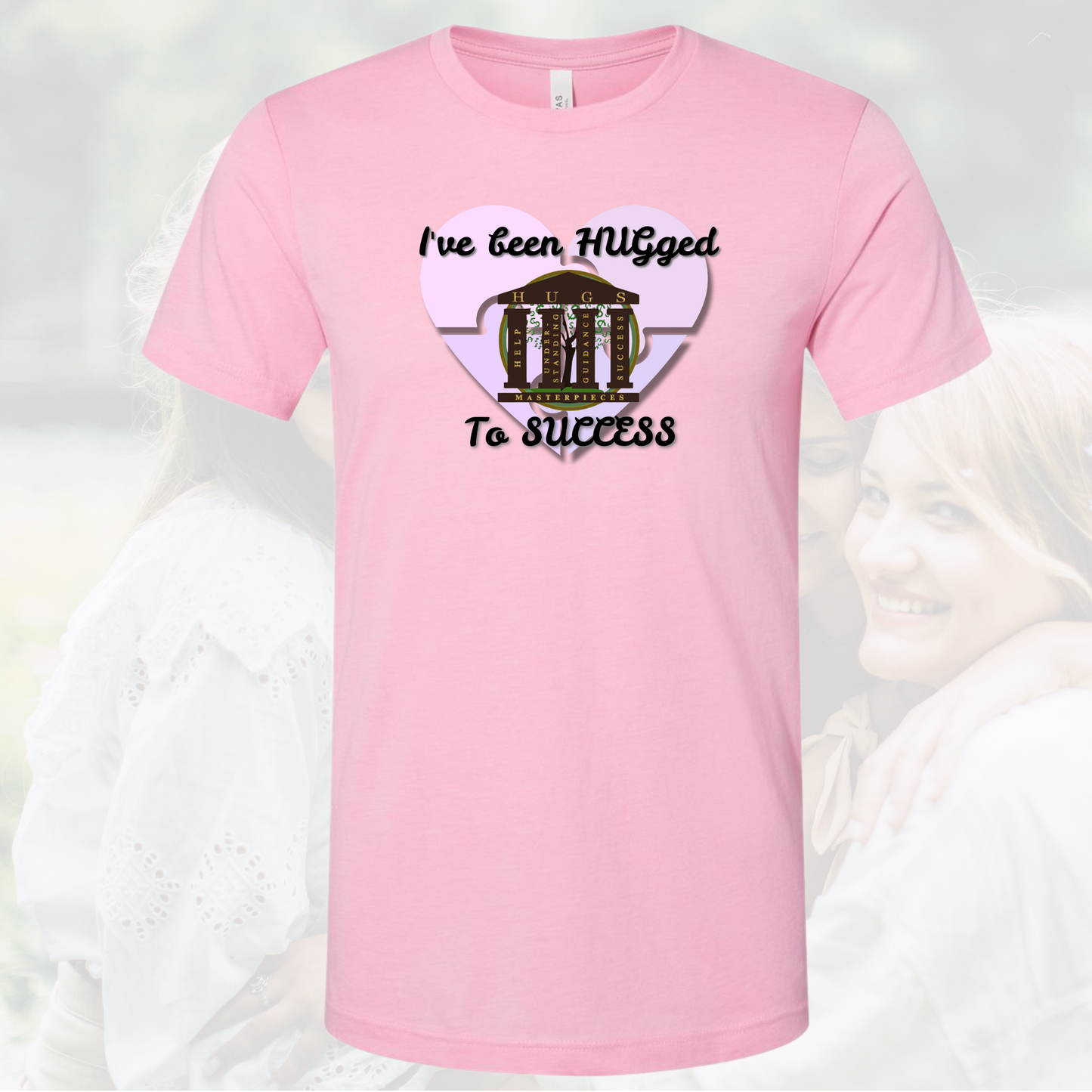 Pink crew neck tee with "I've Been Hugged to Success" text and heart design