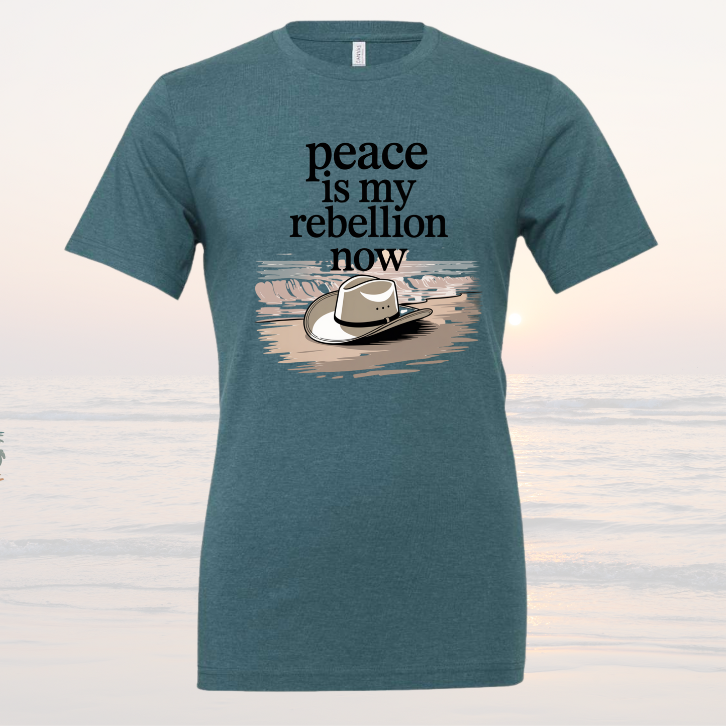 Teal Peace is My Rebellion Now Tee with cowboy hat graphic and loose fit design