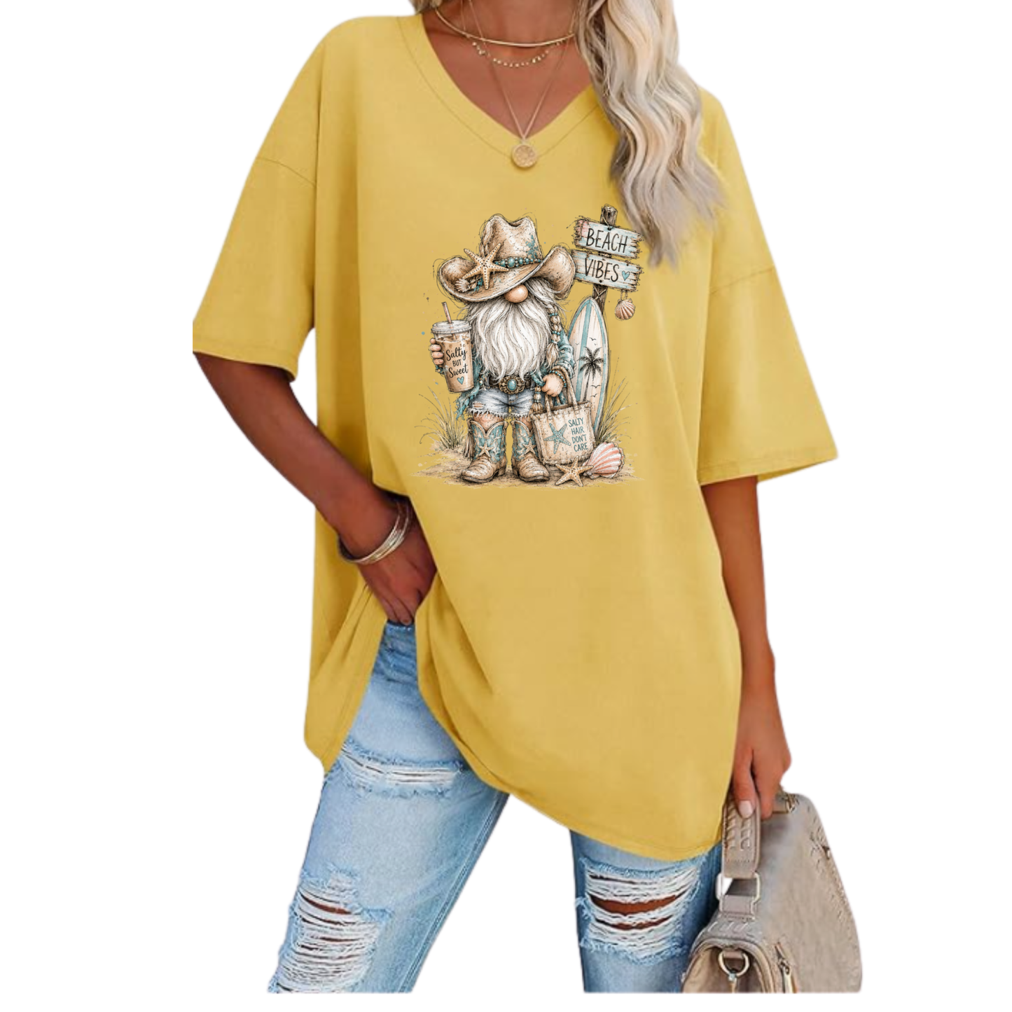 Woman wearing oversized V-neck tunic tee with beach vibes gnome and surfboard design