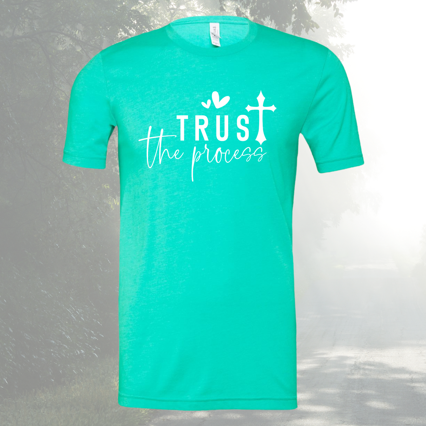 Unisex crew neck tee with "Trust The Process" print in teal.
