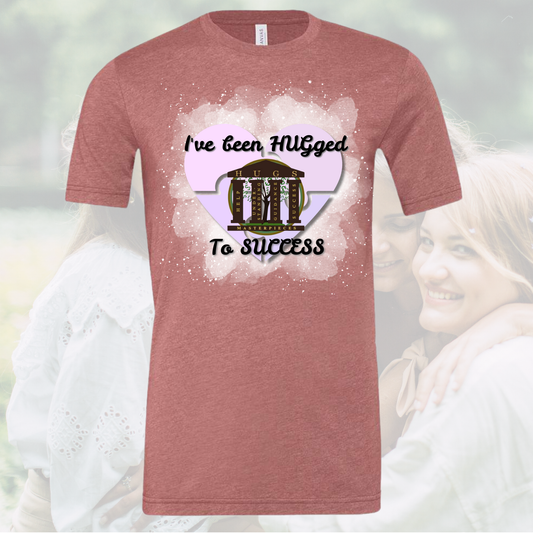 I've Been Hugged to Success crew neck unisex tee in red with motivational graphic design