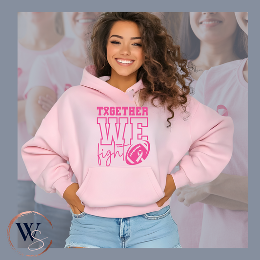 Woman wearing a pink In October We Wear Pink Hoodie with "Together We Fight" text and breast cancer awareness ribbon logo