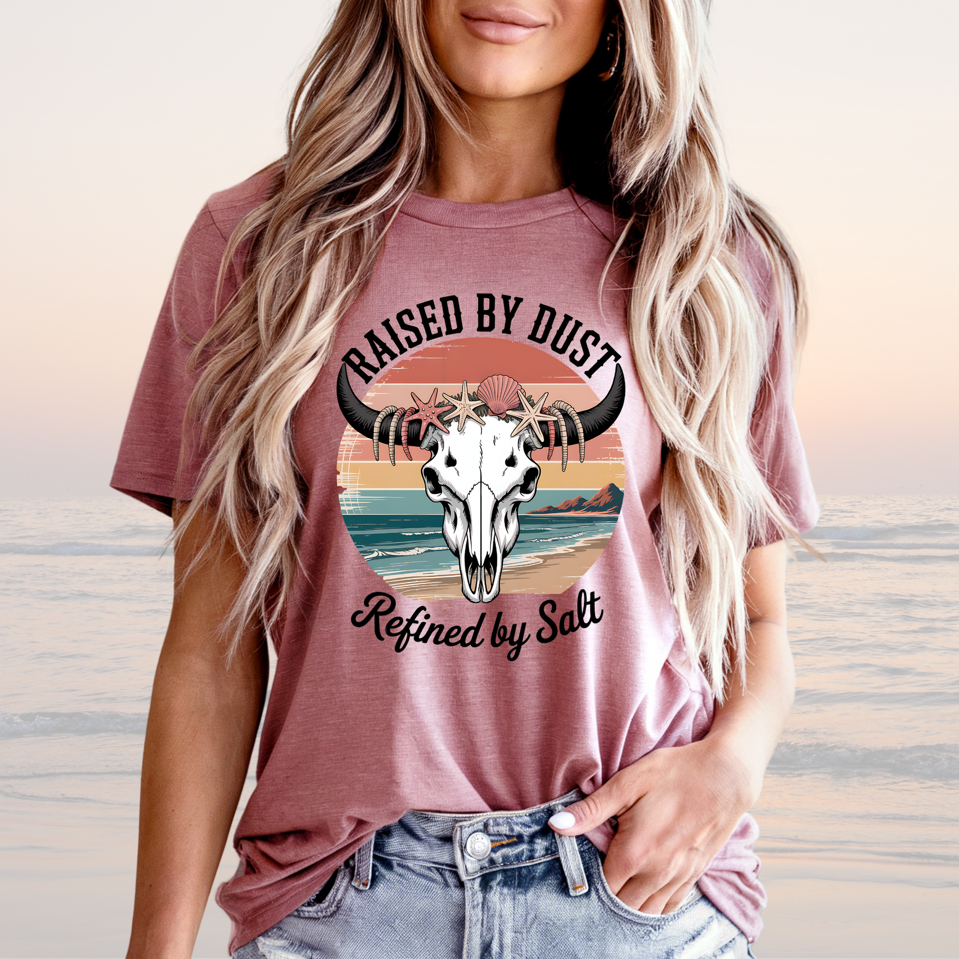 Raised by Dust Graphic T‑Shirt with Coastal Sunset and Bull Skull in Mauve