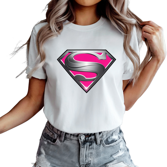 Woman wearing white Pink Superwoman Shirt with pink and silver S logo and distressed denim shorts