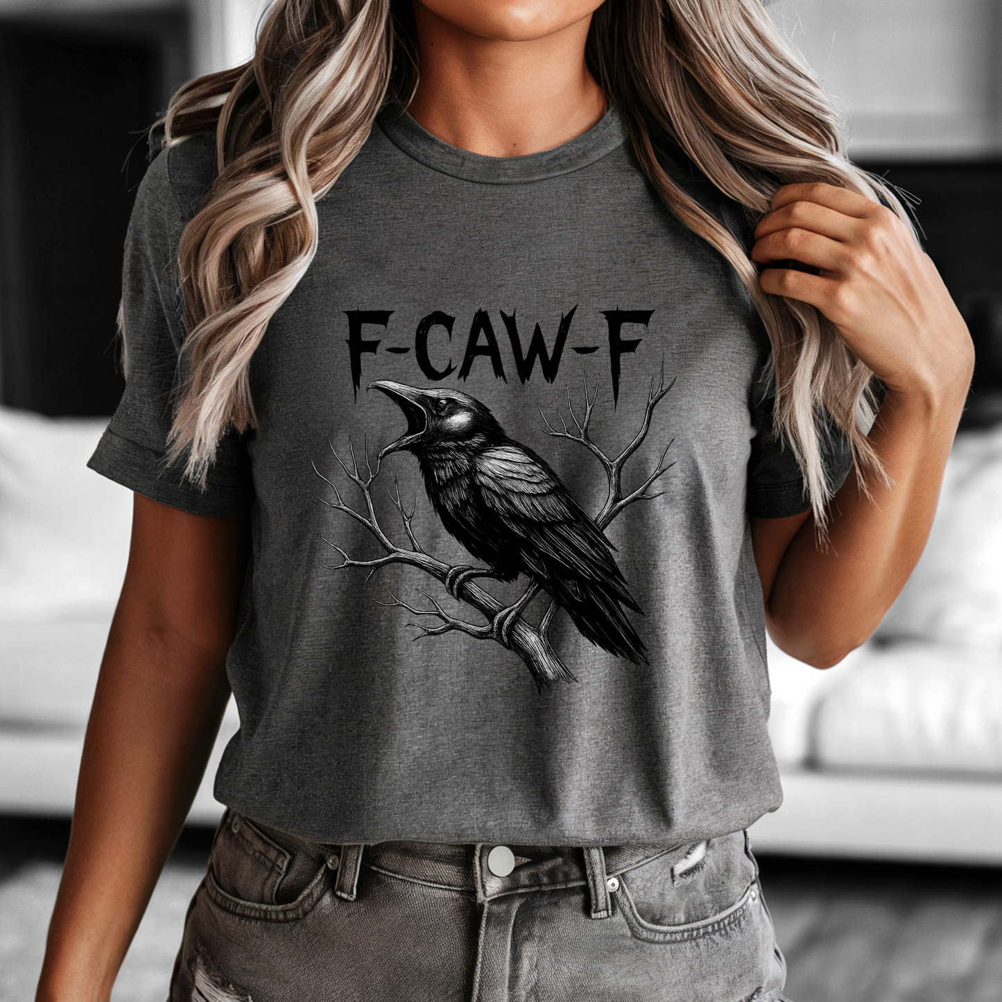 Person wearing a dark gray t-shirt with a crow graphic and 'F-CAW-F' text.