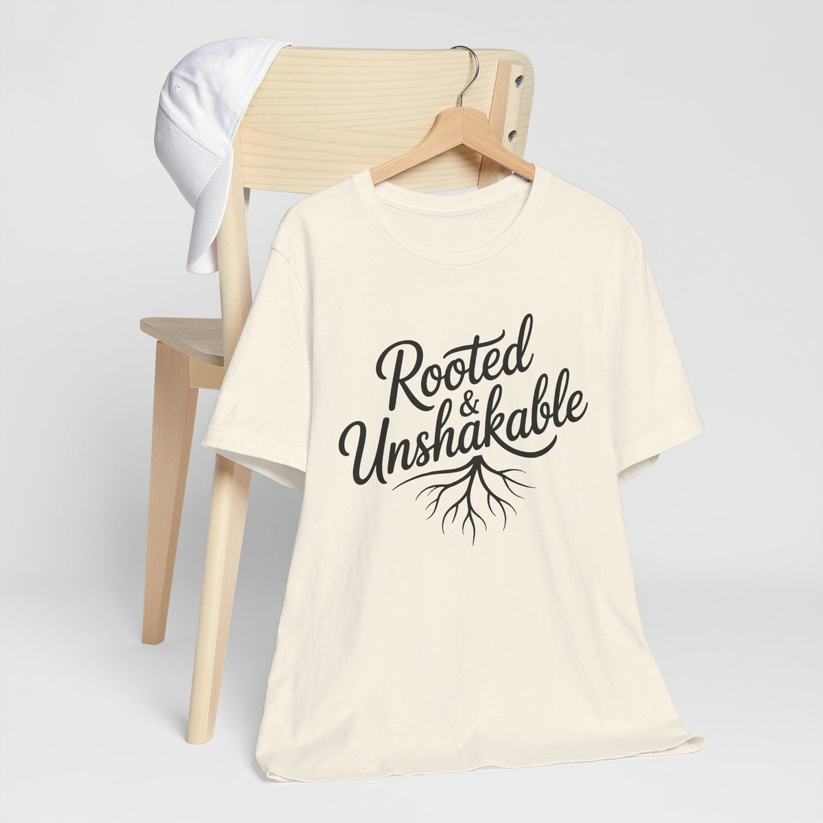 faith tshirt for ladies in ivory cotton with black Rooted Unshakable lettering and delicate tree root graphic