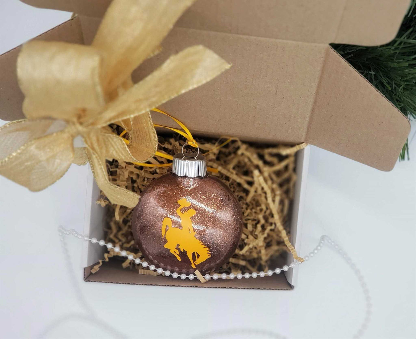 Wyoming Cowboy Ornament with yellow steamboat design in gift box, personalized Christmas decoration.