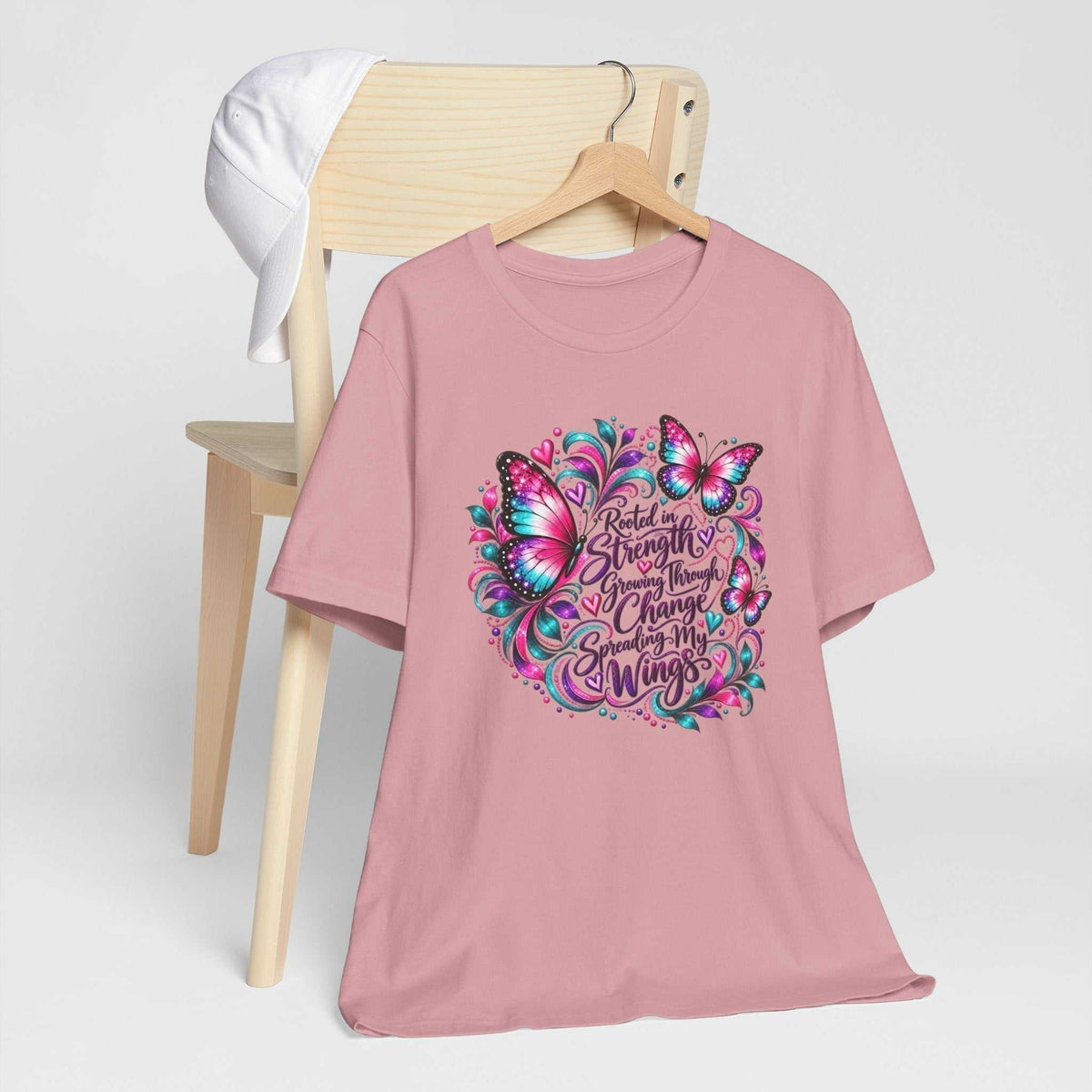 Women's inspirational tshirt design in dusty pink cotton with colorful butterflies and a decorative strength and growth message