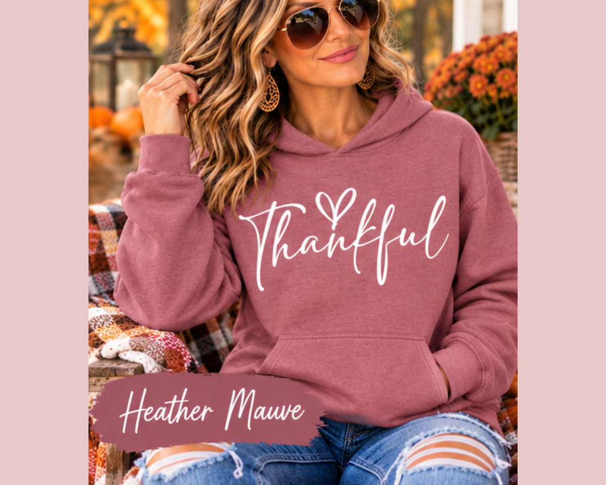 thankful sweatshirt in dusty mauve fleece with white handwritten lettering and a heart, featuring a hood and front pouch pocket