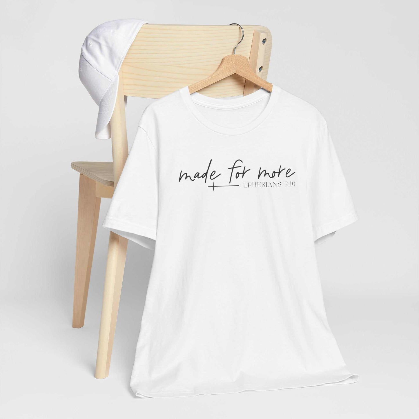 Woman wearing a Made for More Faith Tee with scripture-inspired design from Ephesians 2:10