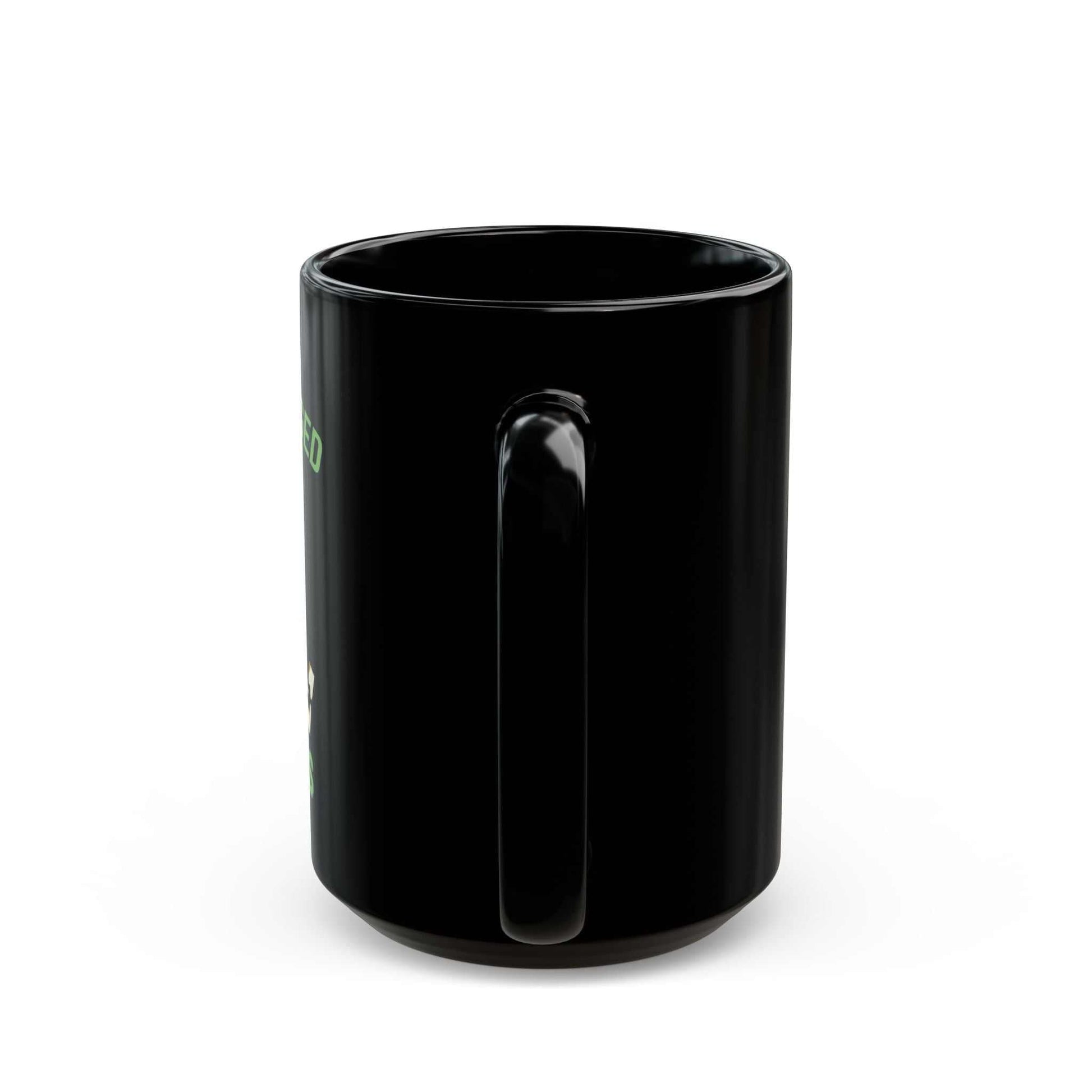 Glossy black coffee mug with mint-green "I've Been Hugged to Success" puzzle design and comfortable C-handle