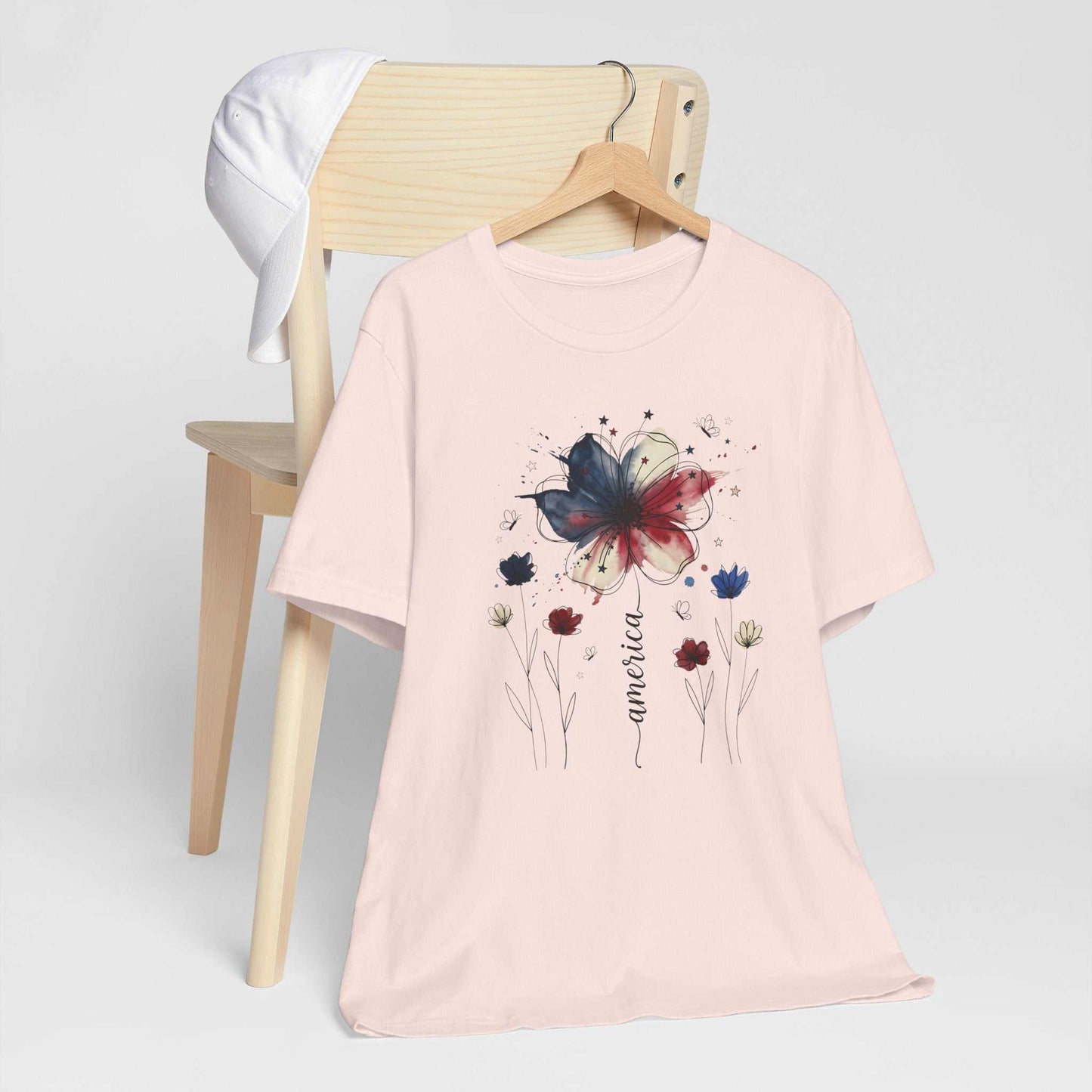 God Bless America Patriotic Floral Tee with red white and blue watercolor flowers and stars on soft Bella Canvas 3001 unisex shirt