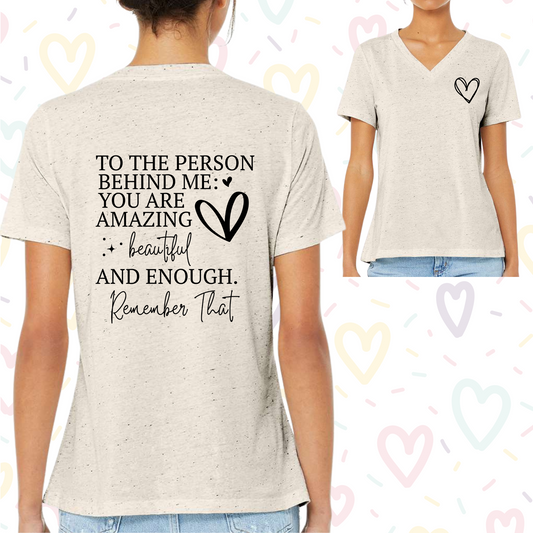 Women's V-neck shirt with "To the Person Behind Me, You Are Enough" inspiring message.