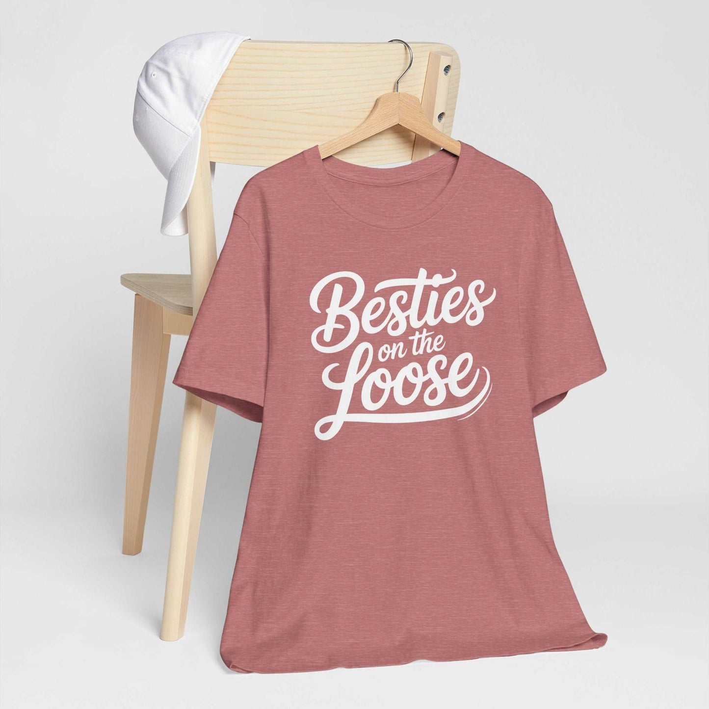 Women wearing Besties on the Loose Tee enjoying a girls' trip outdoors