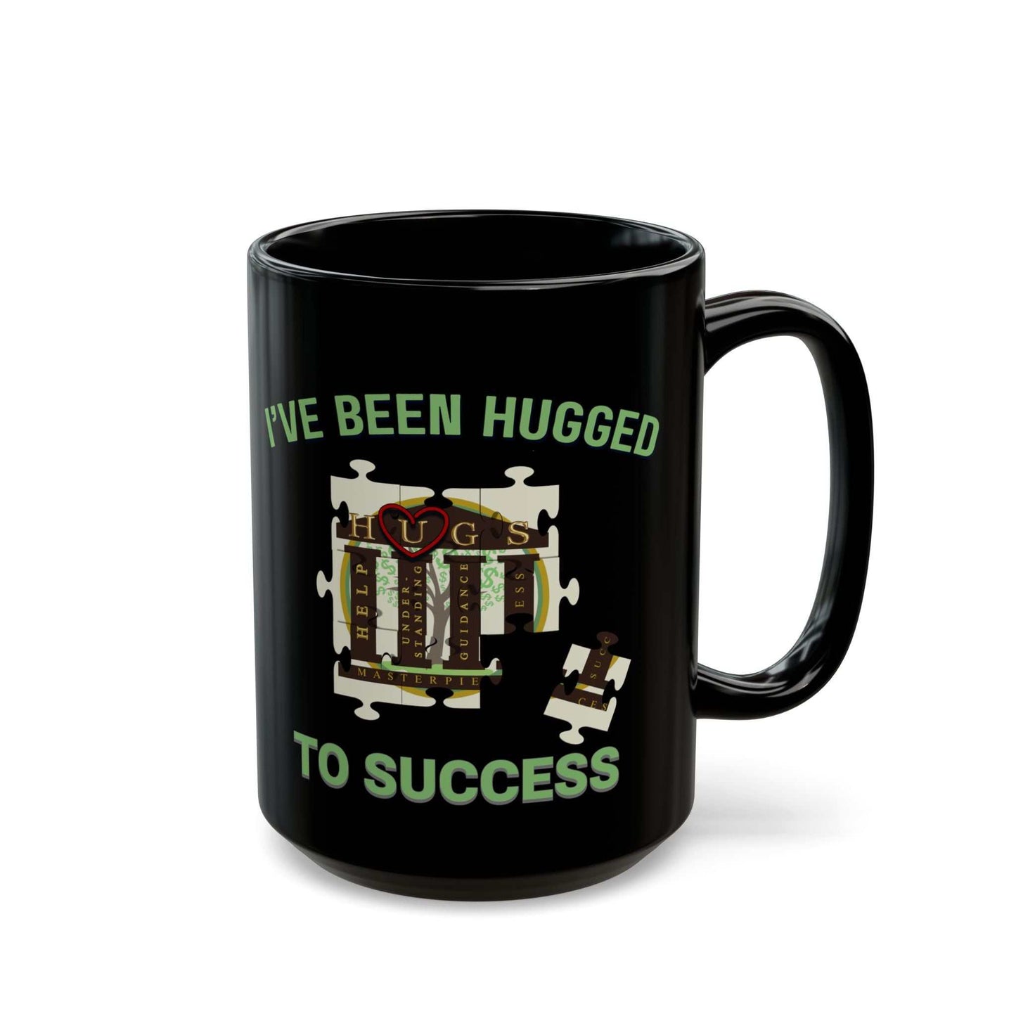 Glossy black coffee mug with mint-green "I've Been Hugged to Success" puzzle design on ceramic surface