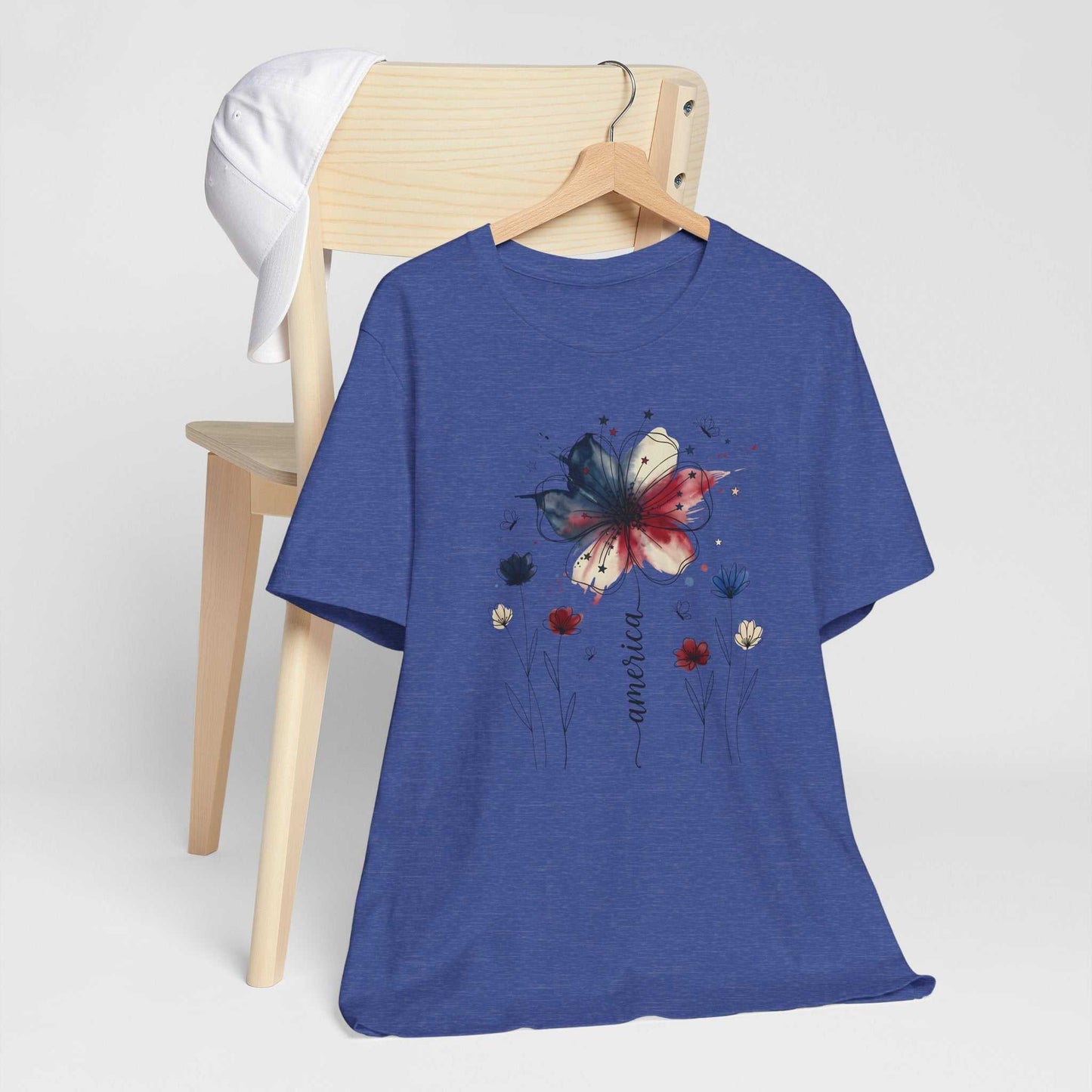 God Bless America Patriotic Floral Tee with red, white, blue watercolor florals and stars on soft Bella Canvas unisex shirt