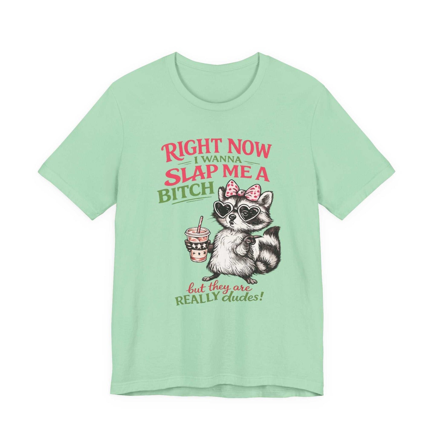 Raccoon graphic tee with pink bow and heart sunglasses saying Right Now I Wanna Slap Me a BITCH in retro distressed pink and sage green lettering