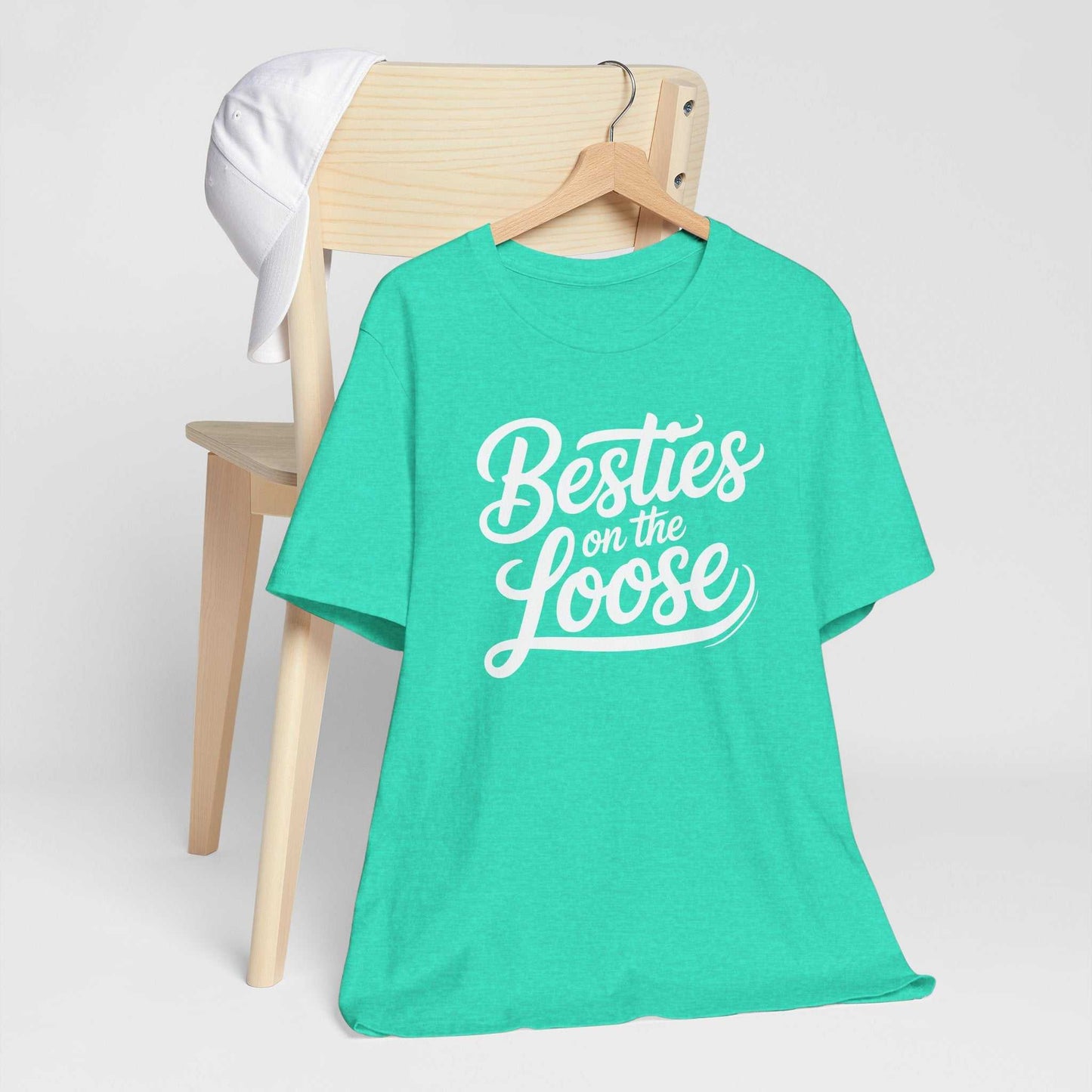 Woman wearing a Besties on the Loose Tee, perfect for girls' trips and friendship celebrations