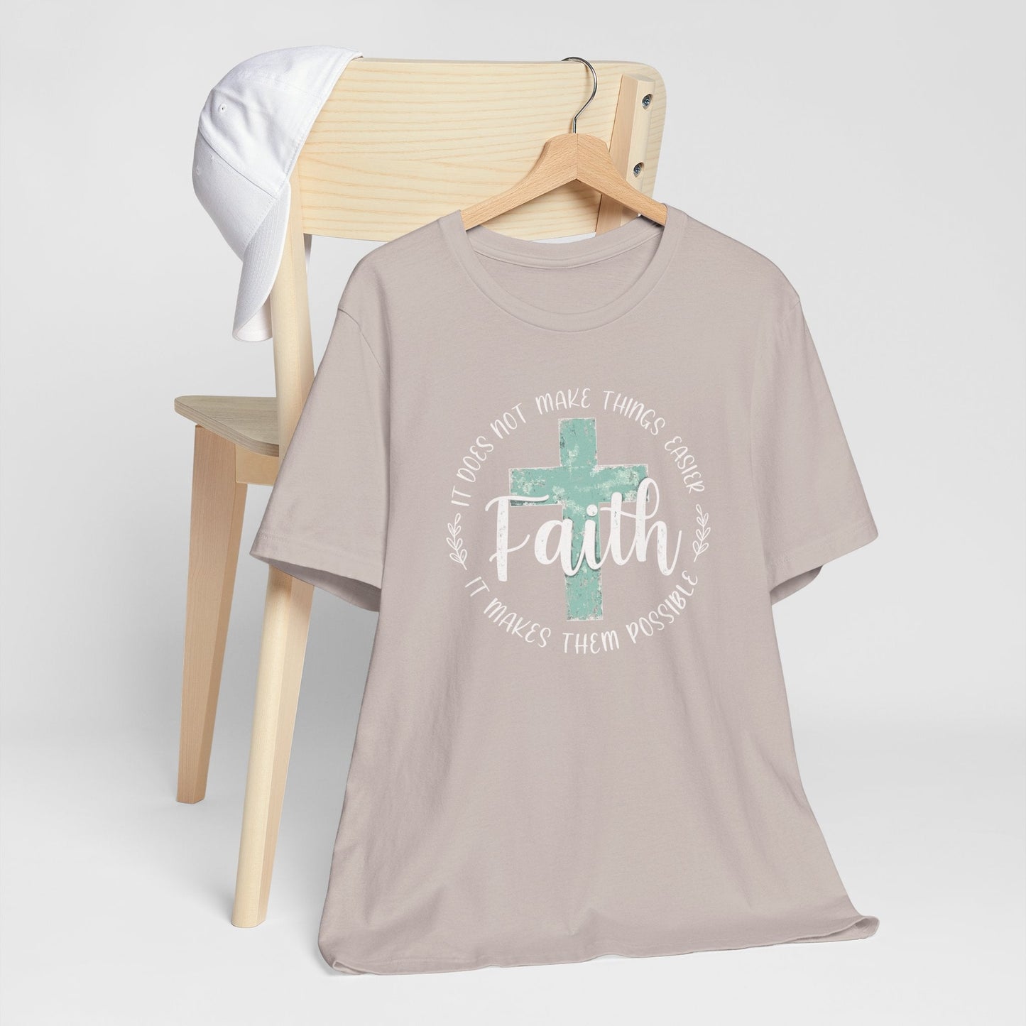 Woman wearing a Faith Over Fear T-shirt with distressed cross design and inspirational Christian message