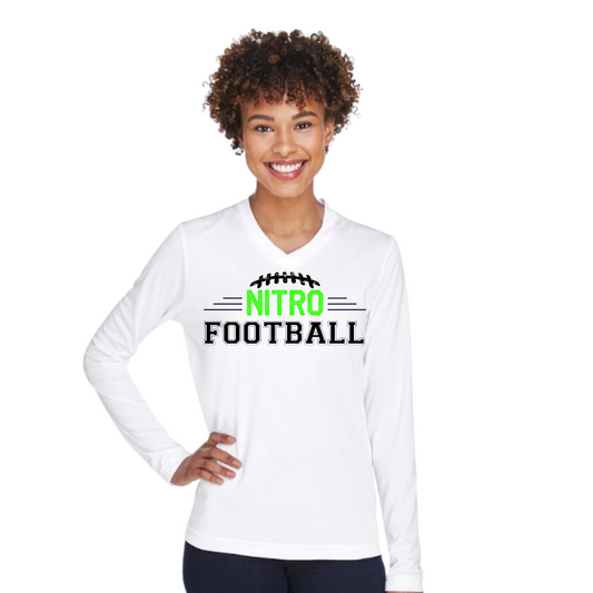 Woman wearing white Long Sleeve Nitro Football t-shirt with green and black text, smiling and standing with hand on hip