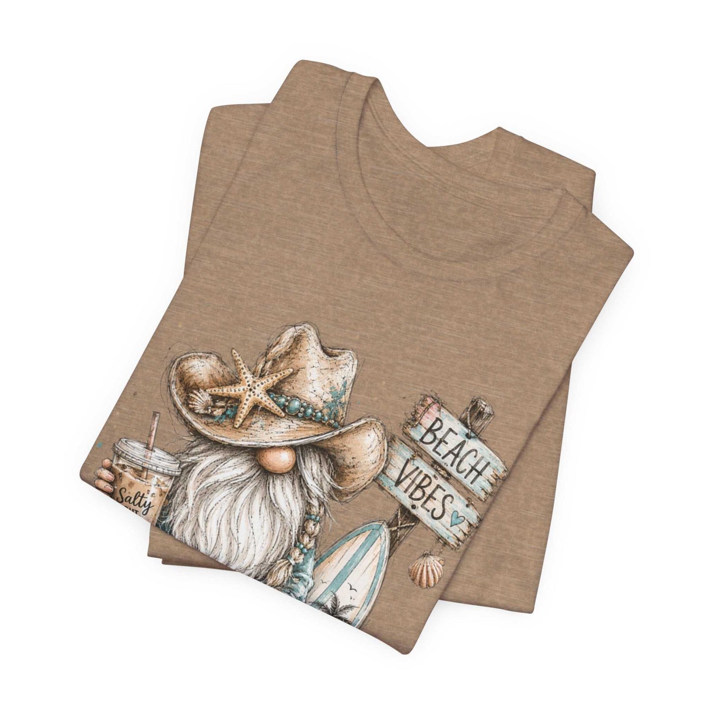 Coastal Cowgirl Beach Gnome t-shirt with turquoise accents, cowboy boots, and seashells in a whimsical watercolor style