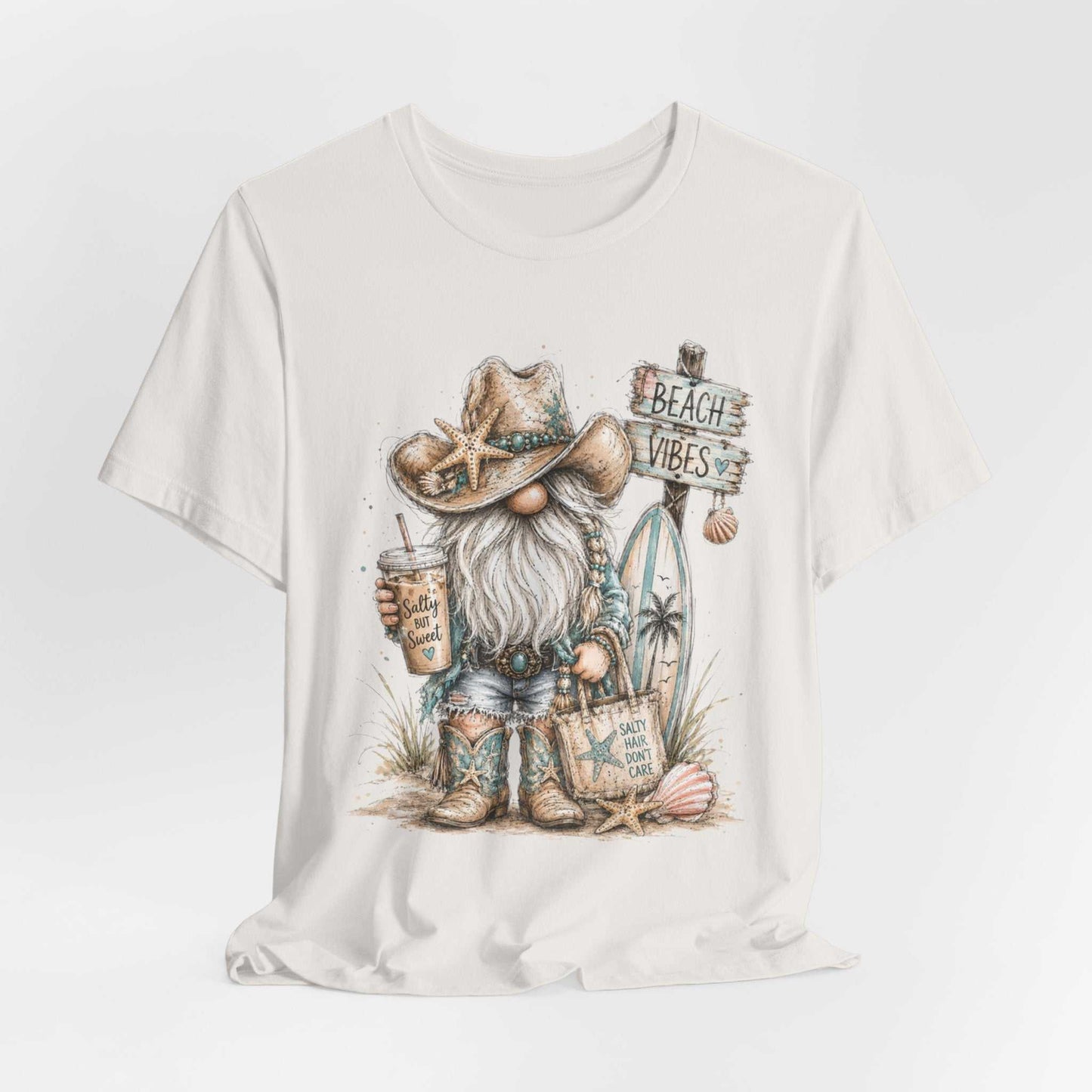Coastal Cowgirl Beach Gnome shirt with turquoise accents, cowboy boots, and watercolor beach design
