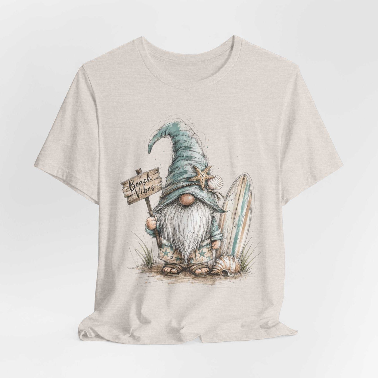 Beach Gnome Shirt with whimsical hand-drawn beach gnome, seashell accents, and coastal watercolor design on a soft unisex tee