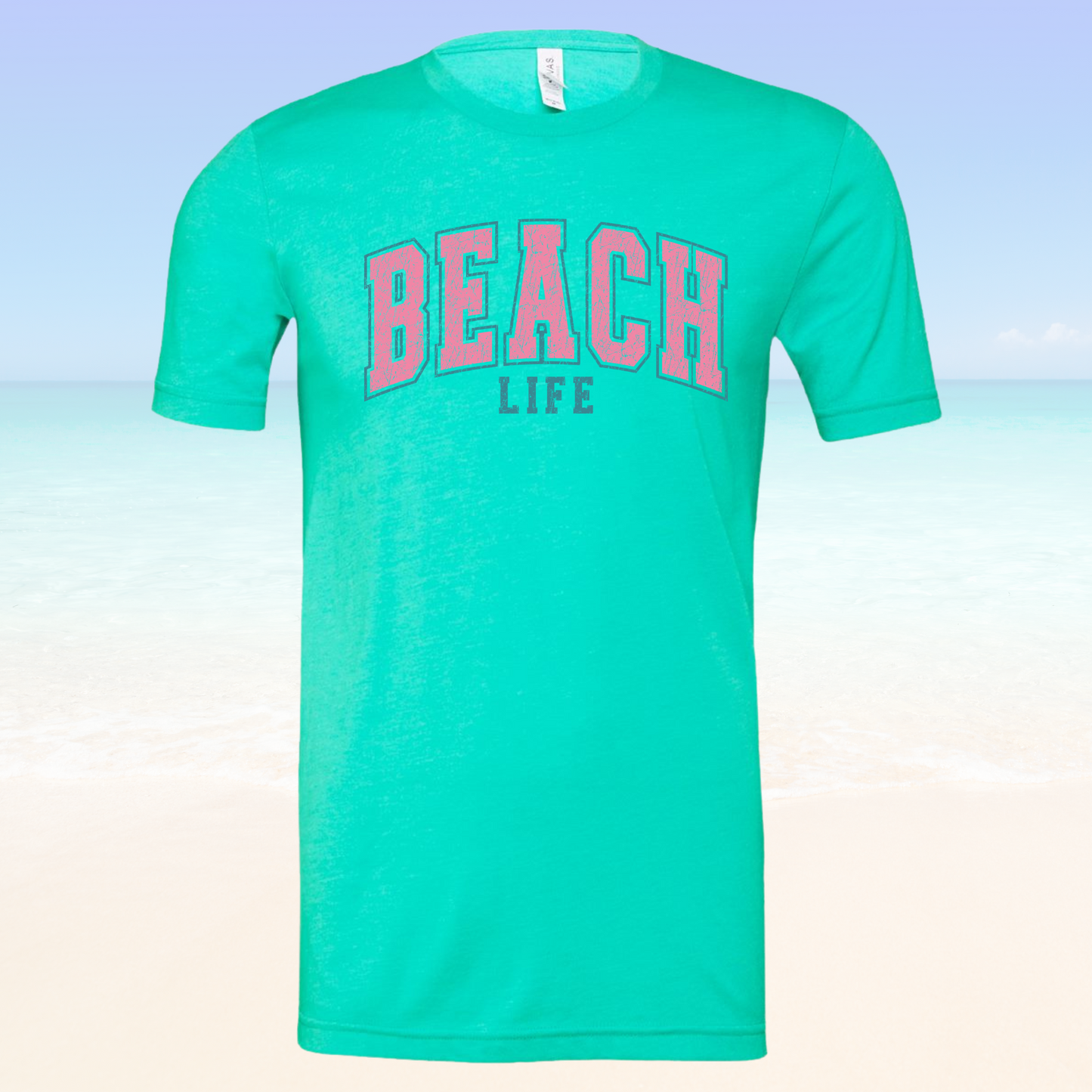 Super soft unisex Beach Life Vibe Tee in turquoise, perfect for a stylish beach day.