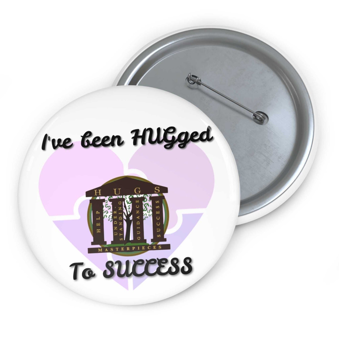 Glossy metal button pin with "I've Been HUGged to Success" text and safety-pin back