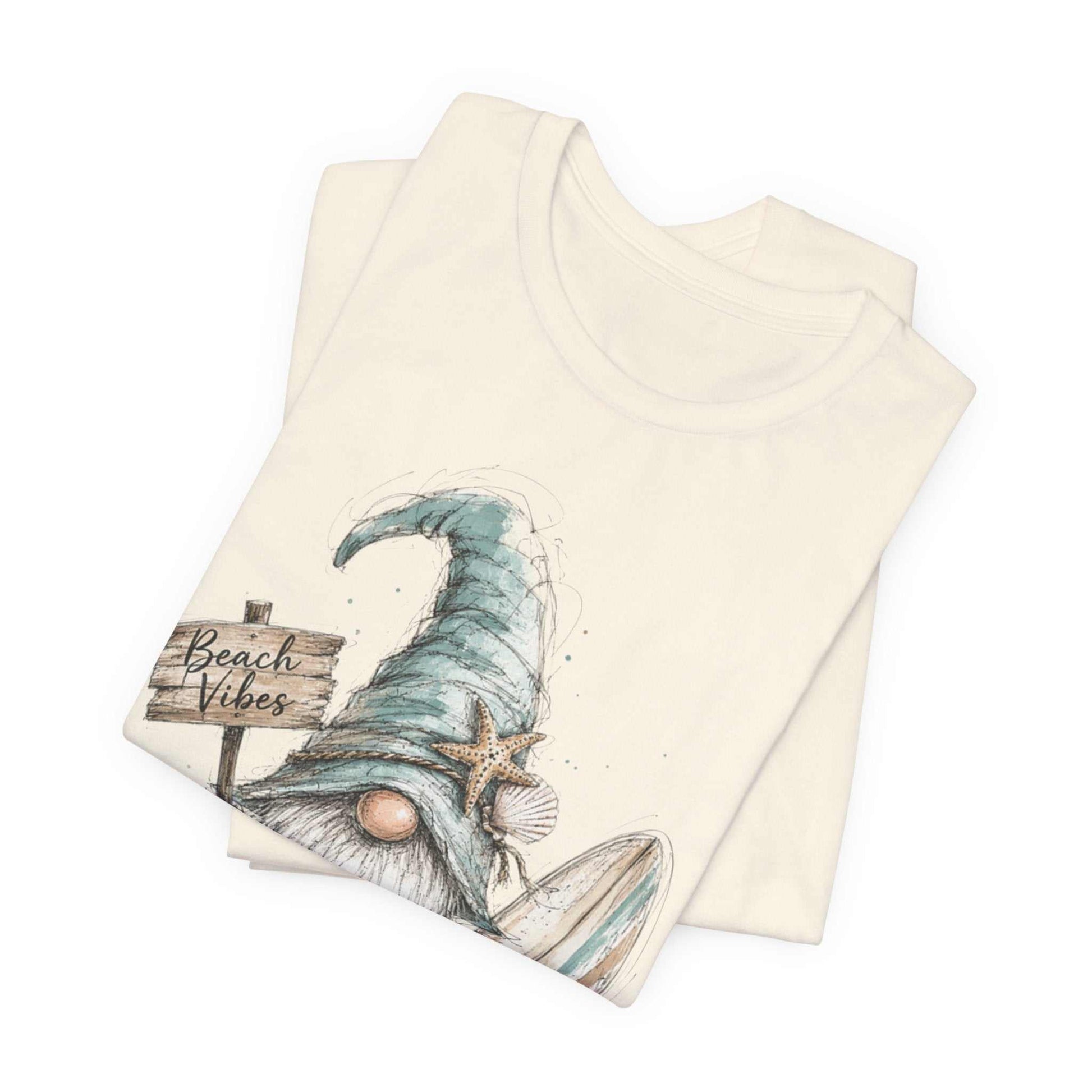 Beach Gnome Shirt with hand-drawn gnome, seashells, and watercolor coastal design on a soft unisex tee
