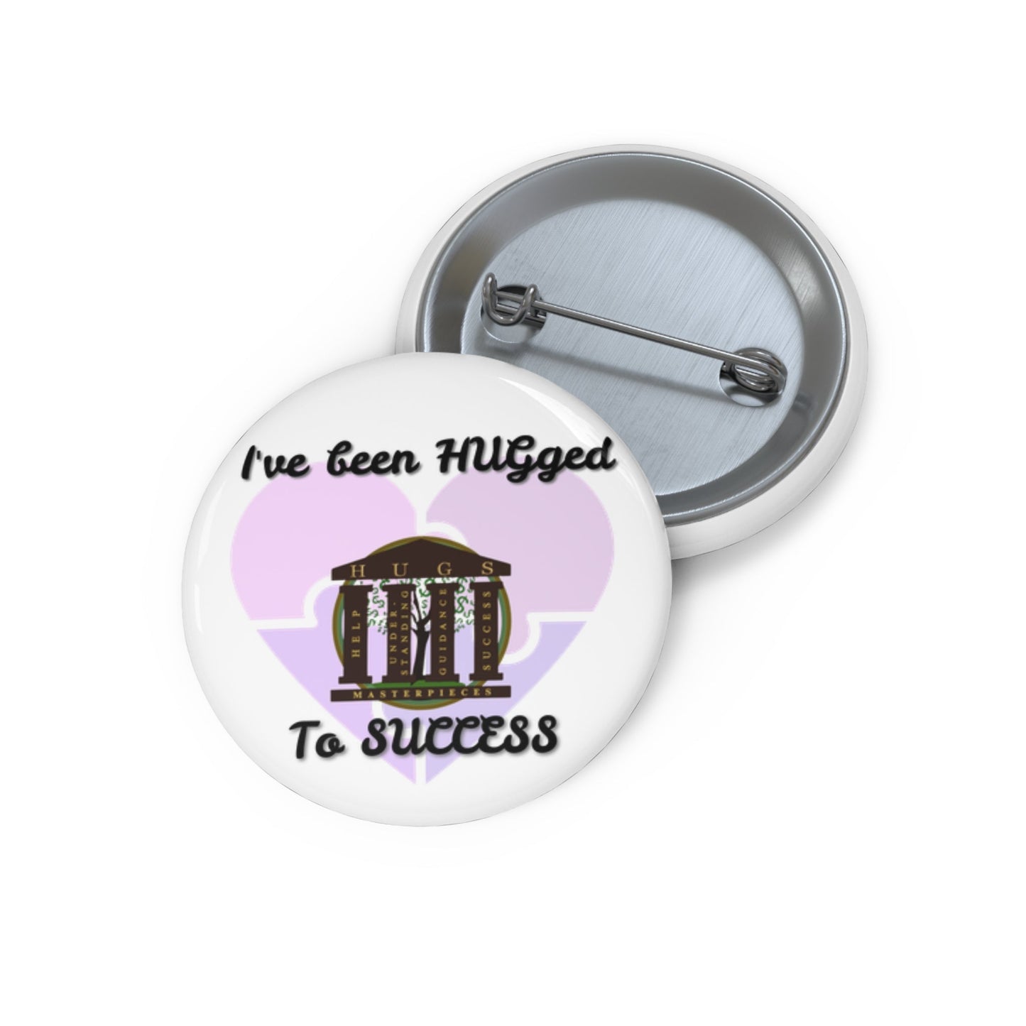 Glossy metal button pin with "I've Been HUGged to Success" text and steel safety-pin back