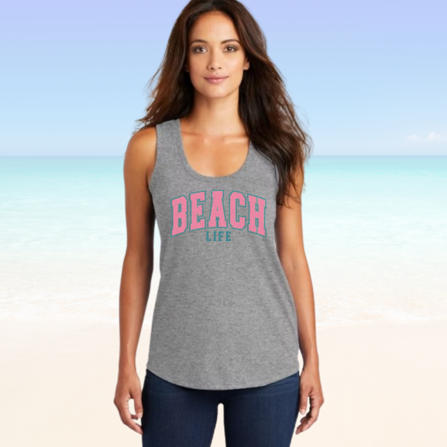 Woman wearing a Beach Life tank top on a beach background.