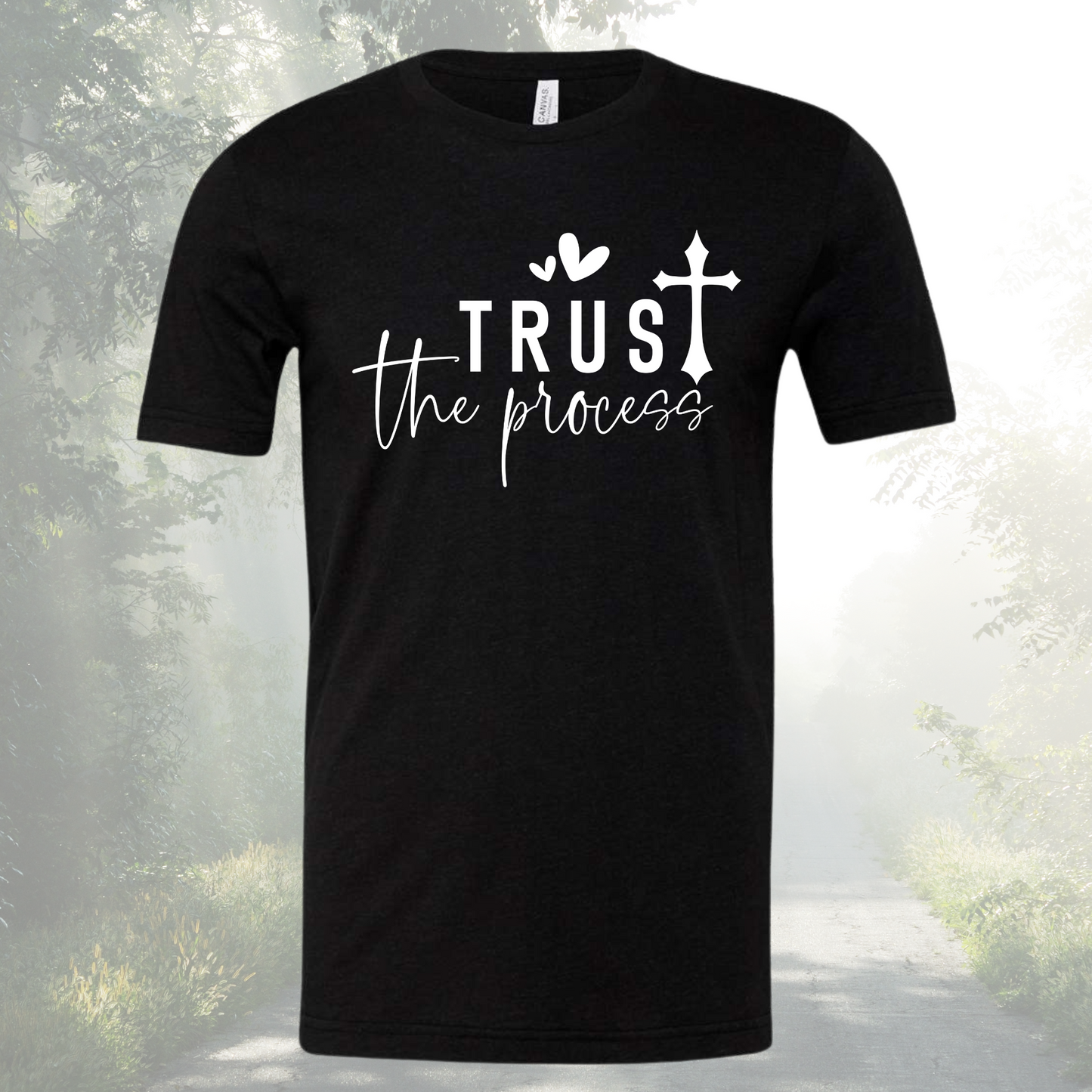 Unisex crew neck tee with "Trust The Process" design in black.