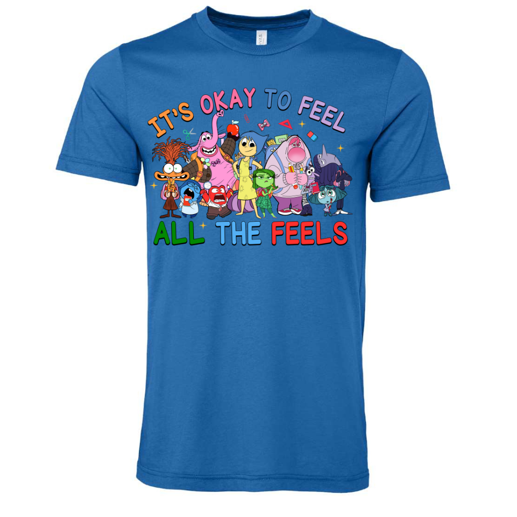 Unisex blue crew neck shirt with "It's Ok To Feel All the Feels" design featuring colorful cartoon characters.