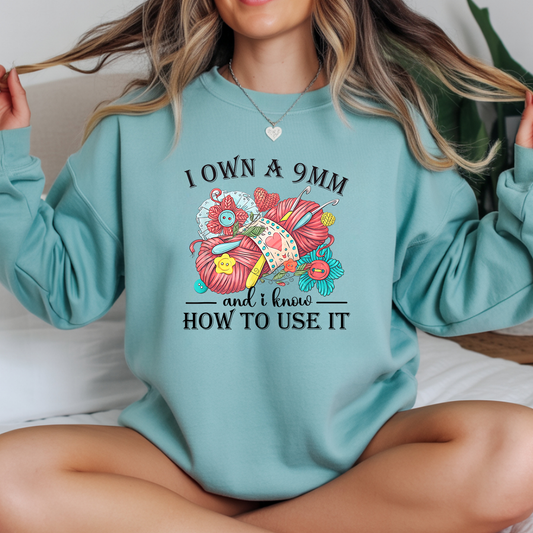 I Own A 9MM and I know HOW TO USE IT Sweatshirt