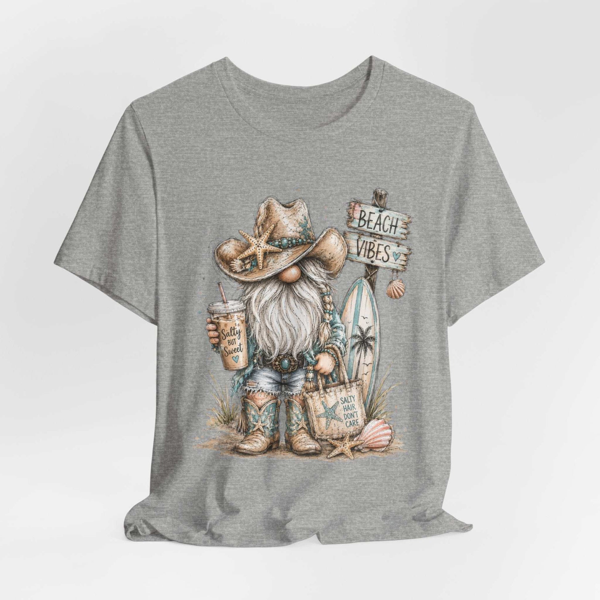 Coastal Cowgirl Beach Gnome t-shirt with turquoise accents, cowboy boots, and seaside watercolor design