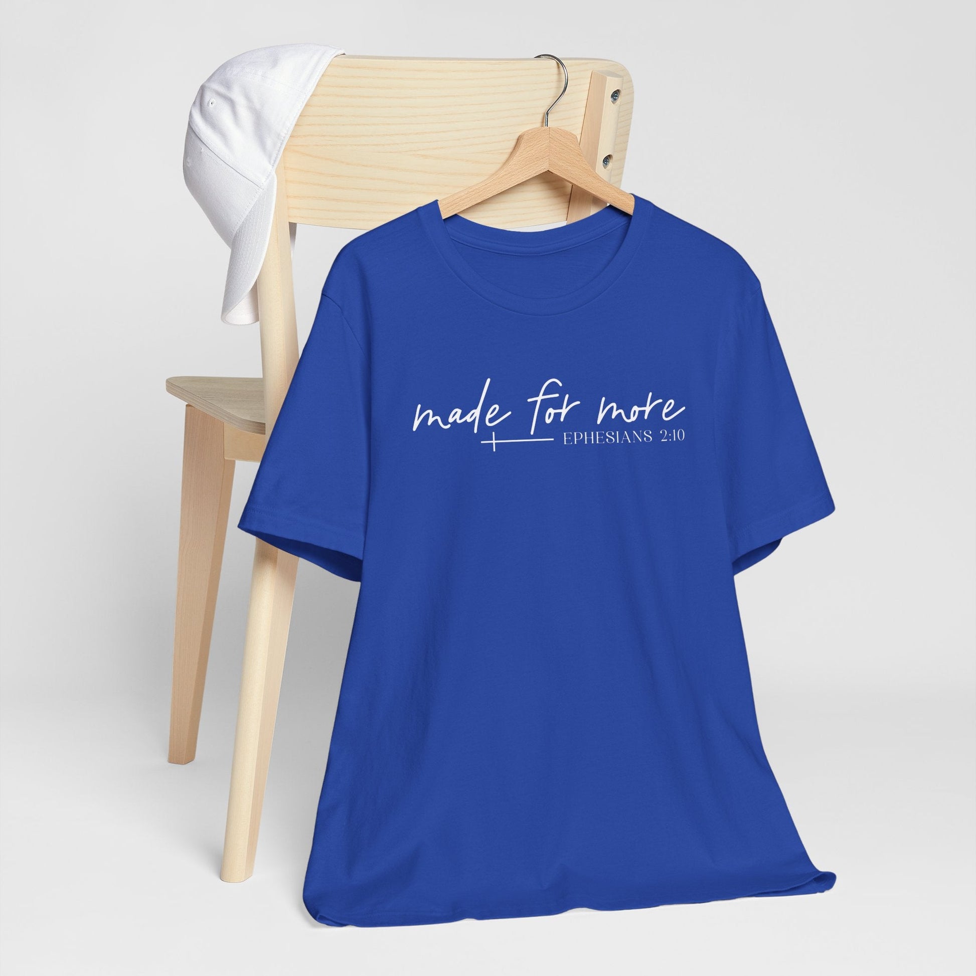 Woman wearing a Made for More Faith Tee inspired by Ephesians 2:10 with a simple script design