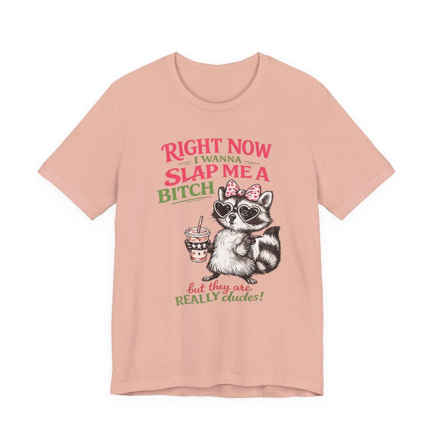 Graphic tee with sassy raccoon and quote "Right Now I Wanna Slap Me a BITCH" in pink and sage green distressed lettering