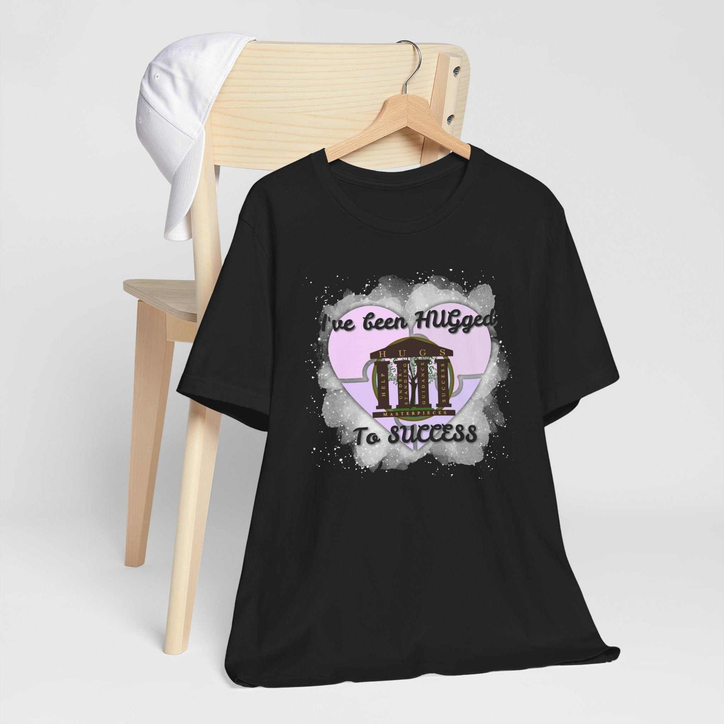 Lightweight pale blush Hugged To Success Tee with vintage storefront and pastel heart graphic.