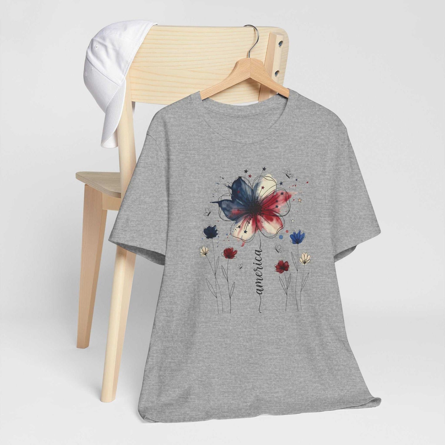 God Bless America Patriotic Floral Tee with red white and blue watercolor florals and stars on soft Bella Canvas 3001 unisex shirt