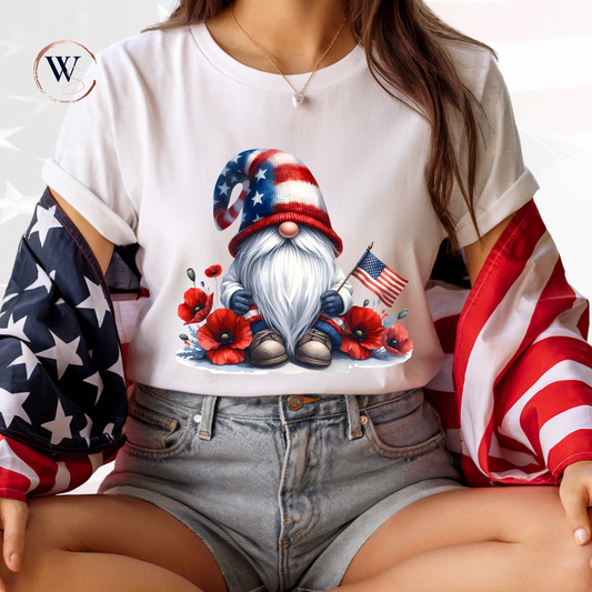 Gnome with American Flag Tee showcasing an adorable gnome holding a U.S. flag, perfect for patriotic celebrations.