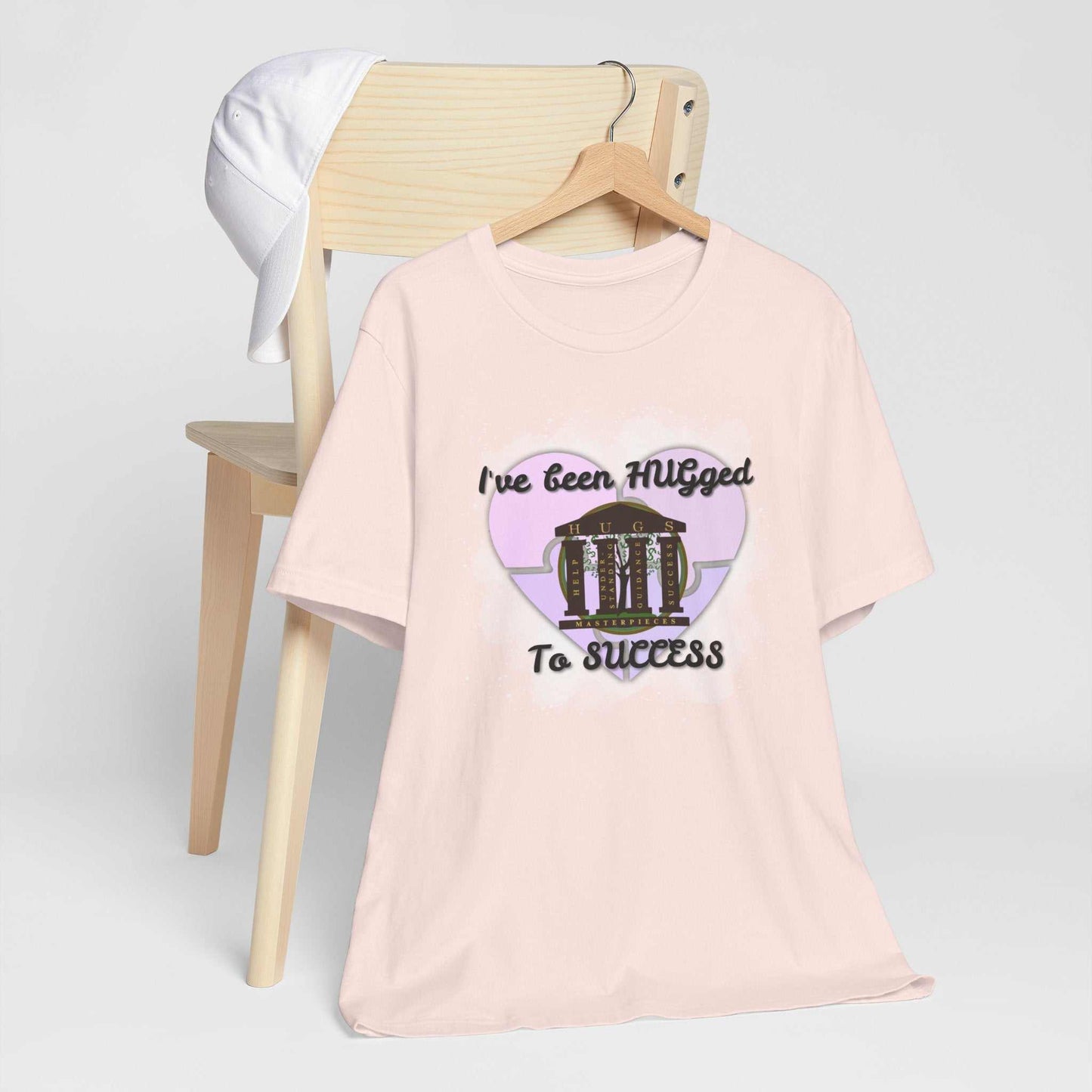 Lightweight pale blush Hugged To Success Tee with vintage storefront and pastel heart graphic
