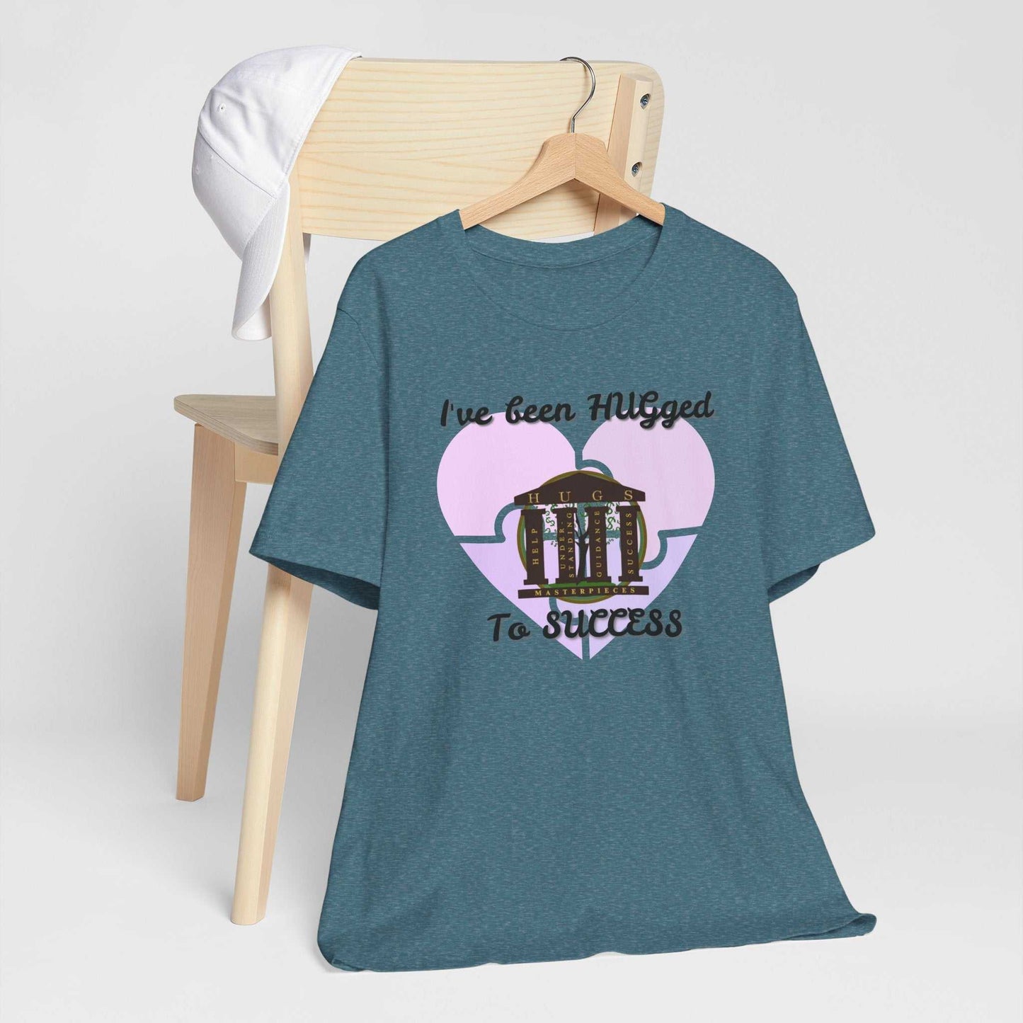 Lightweight blush Hugged To Success Tee with vintage heart storefront graphic and hand-lettered design