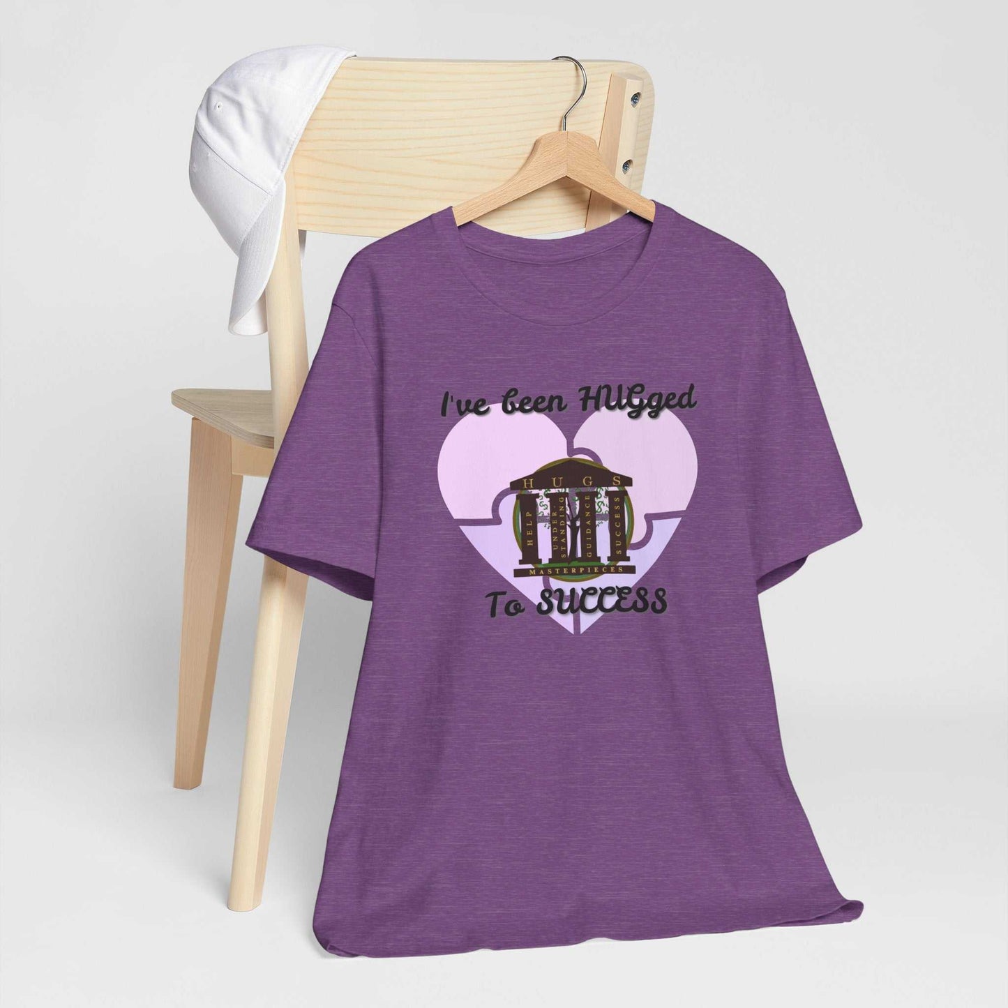 Lightweight pale blush Hugged To Success Tee with vintage storefront and pastel heart graphic on front