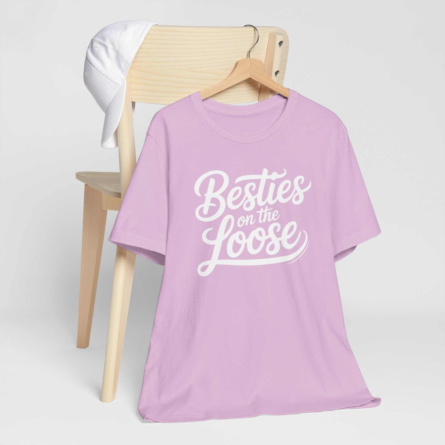 Women wearing Besties on the Loose Tee, a soft unisex Bella Canvas 3001 friendship t-shirt perfect for girls' trips and best friend gifts